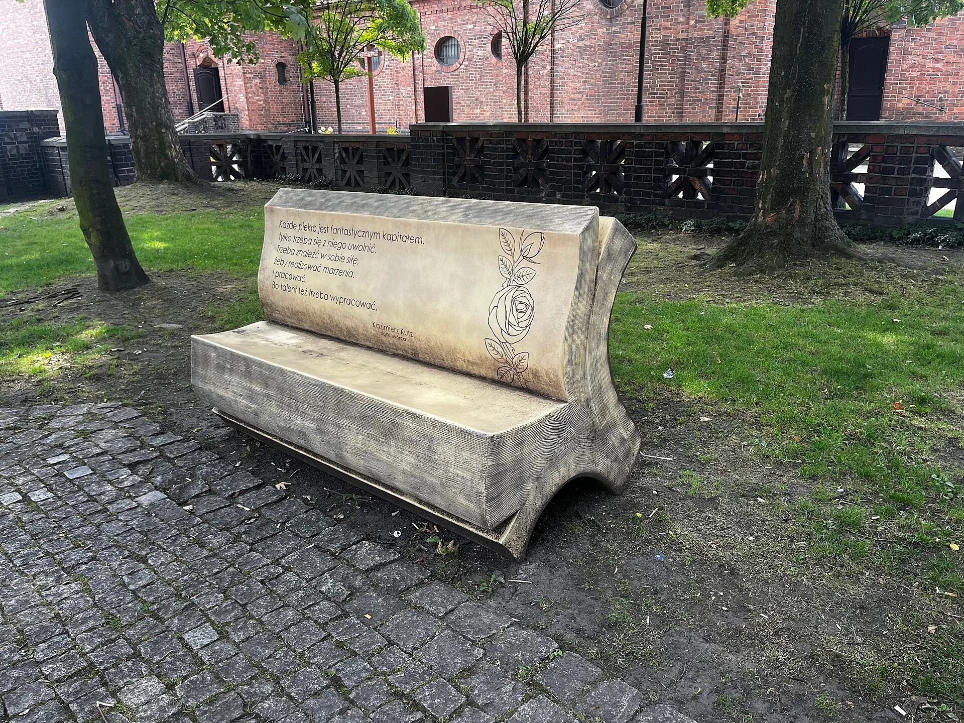 Book shaped bench with quote from Kazimierz Kutz in small park in Nikiszowiec, 2024. Wikiquote vs Goodreads: Which Quote Database Is More Accurate?